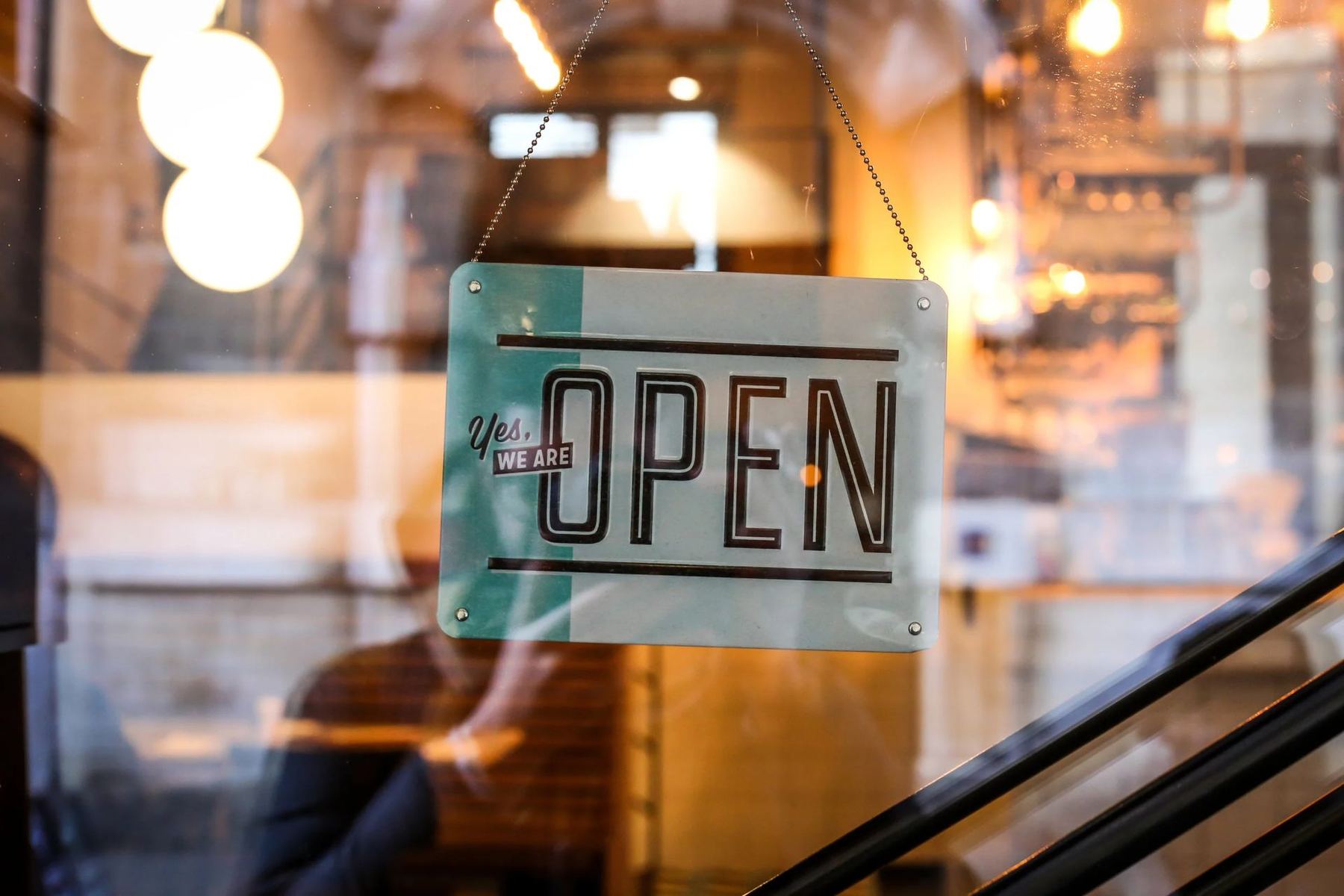 An open sign on a shop door